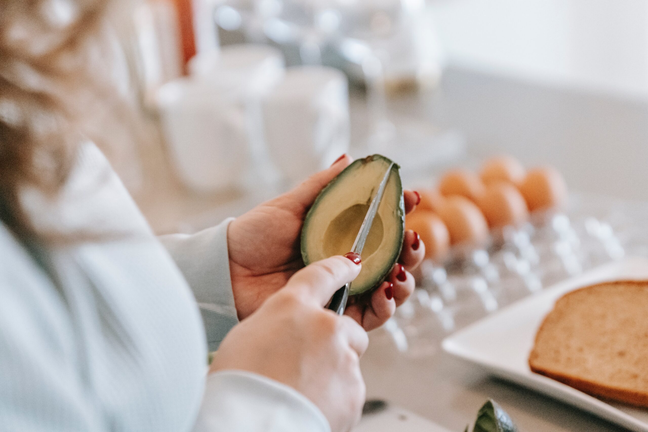 Avocado being cut representing a hysterectomy