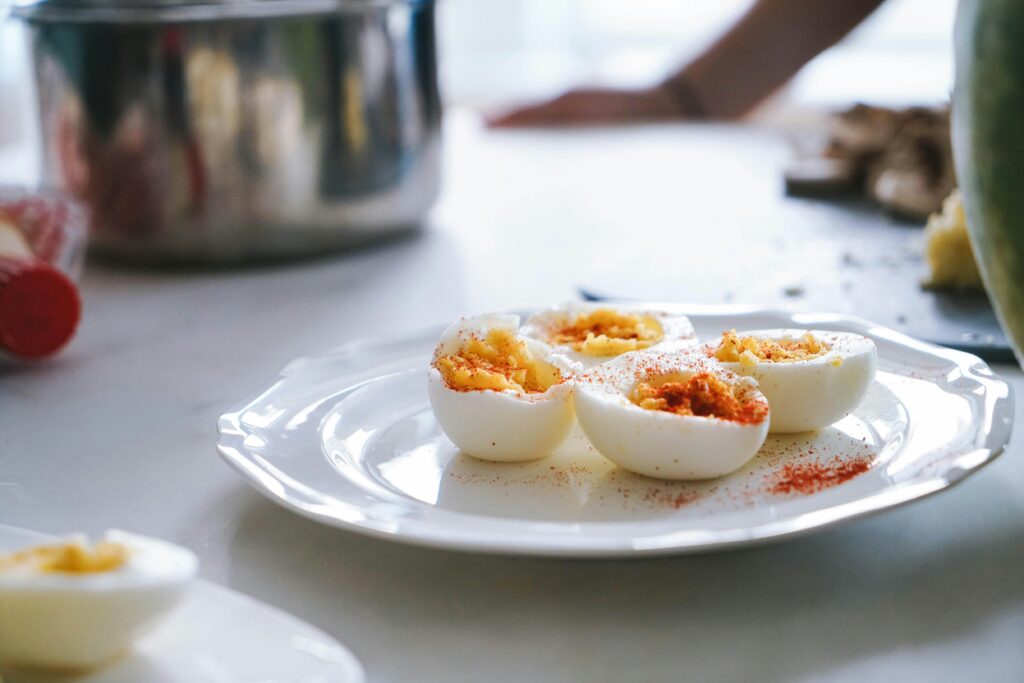 Boiled eggs with a dash of paprika as a healthy savoury snack that is menopause friendly
