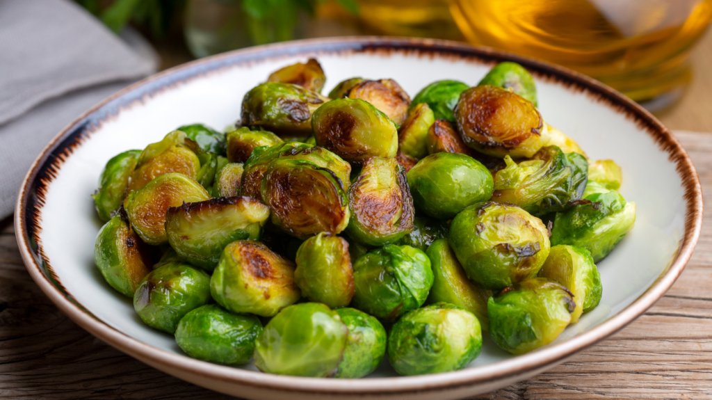 A bowl of cooked Brussel Sprouts for cooling food when going through menopause and hot flashes.