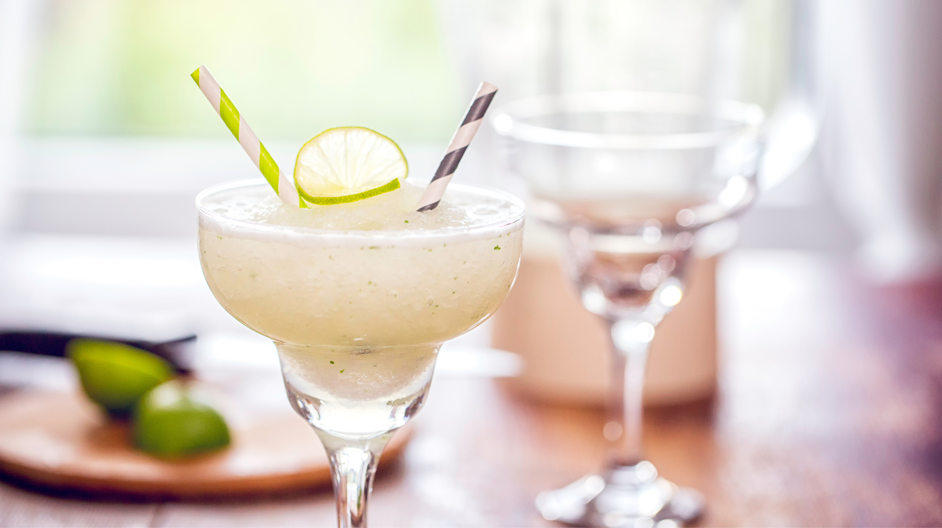 Another firm favourites of the mocktail drinks - a virgin frozen margarita in a cocktail glass with two straws