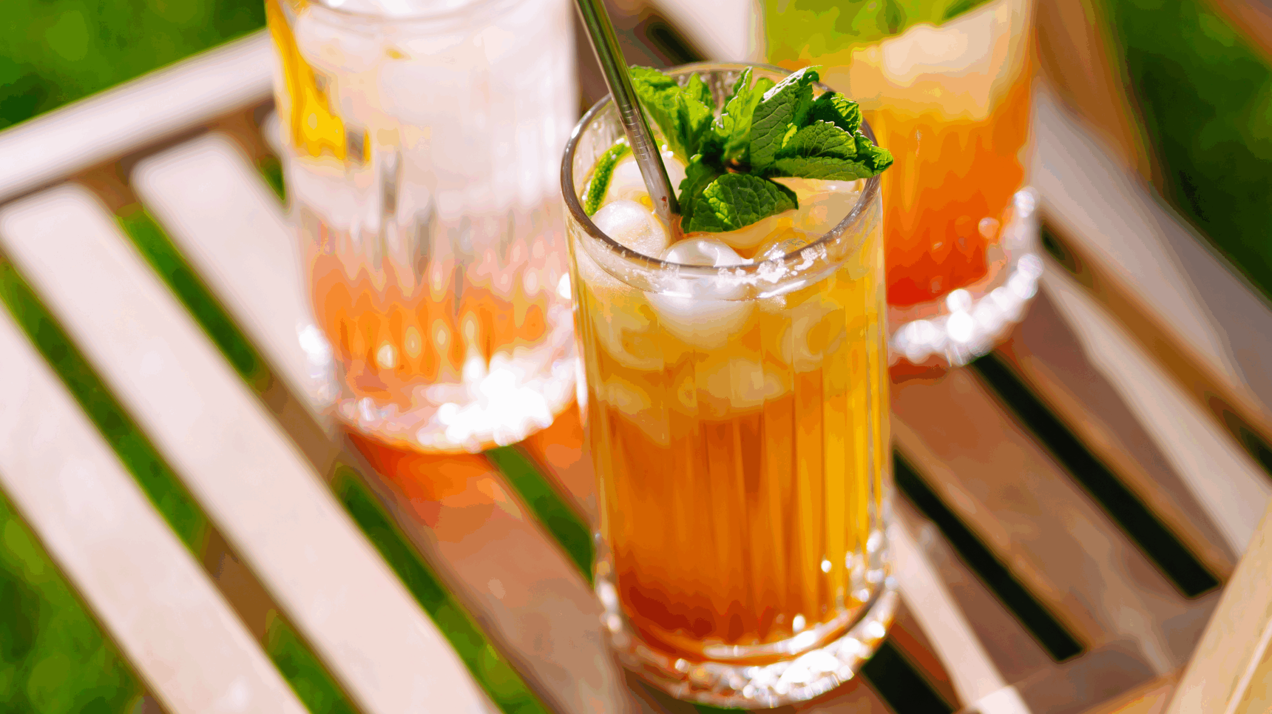 Three glasses of mocktail drinks - a summer cocktail that is like Pimms without alcohol.