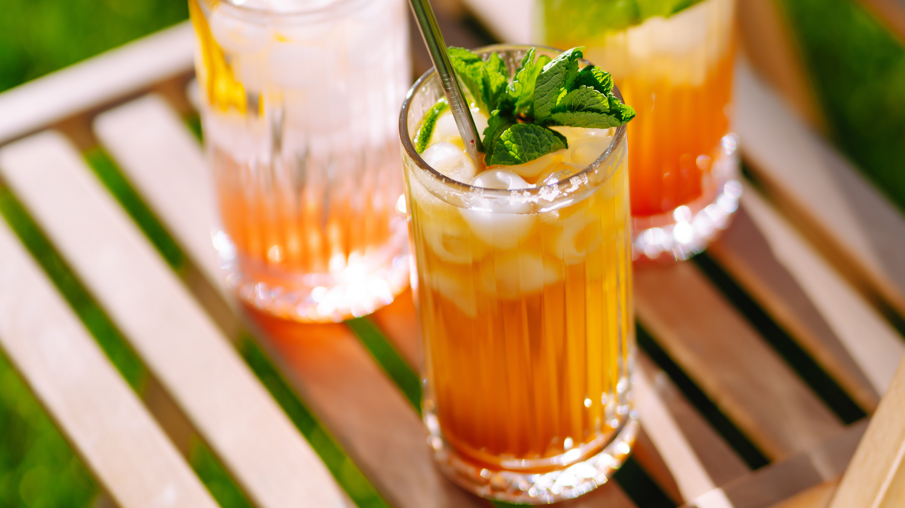Three glasses of mocktail drinks - a summer cocktail that is like Pimms without alcohol.